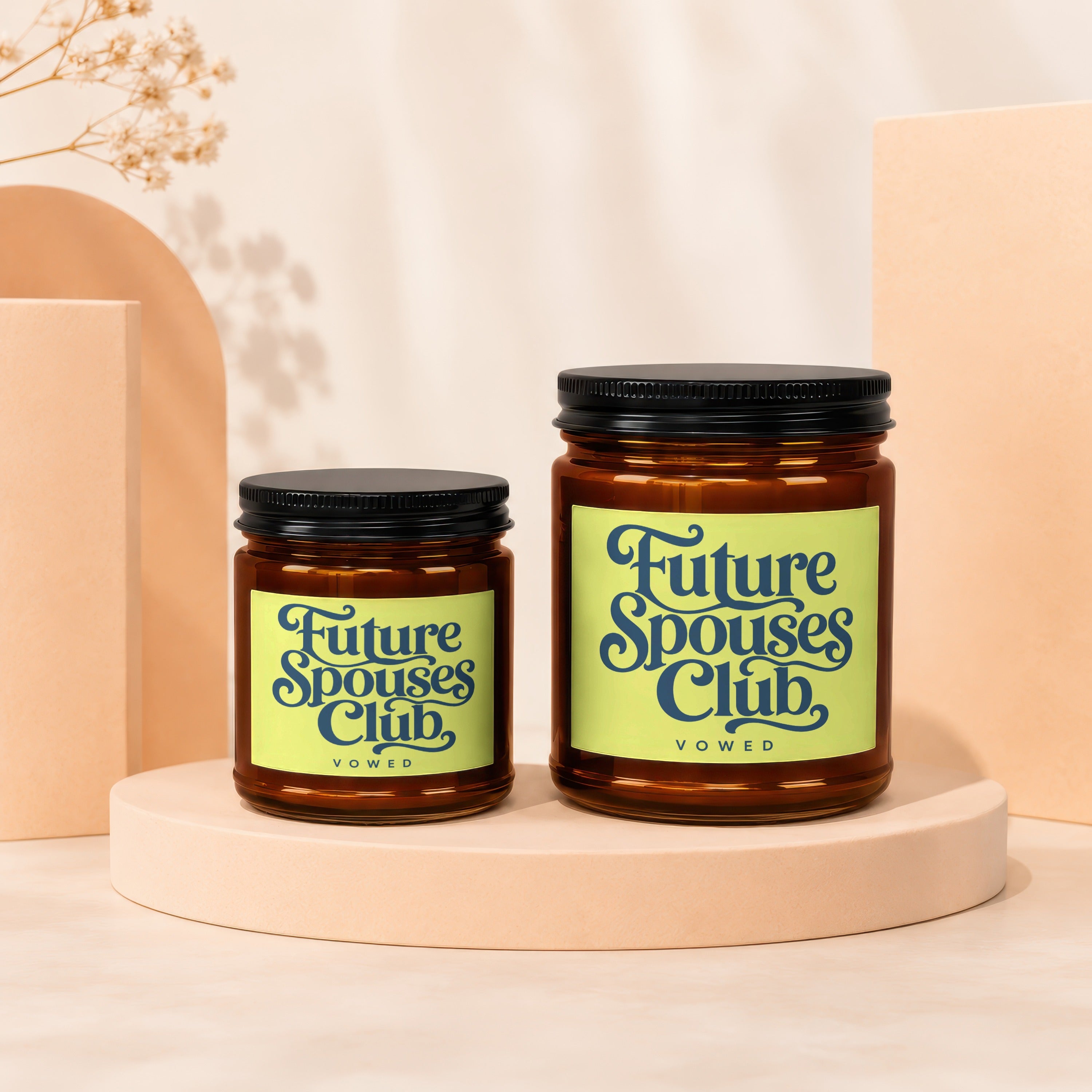 Two amber glass candles with "Future Spouses Club, VOWED" labels on lime green squares.