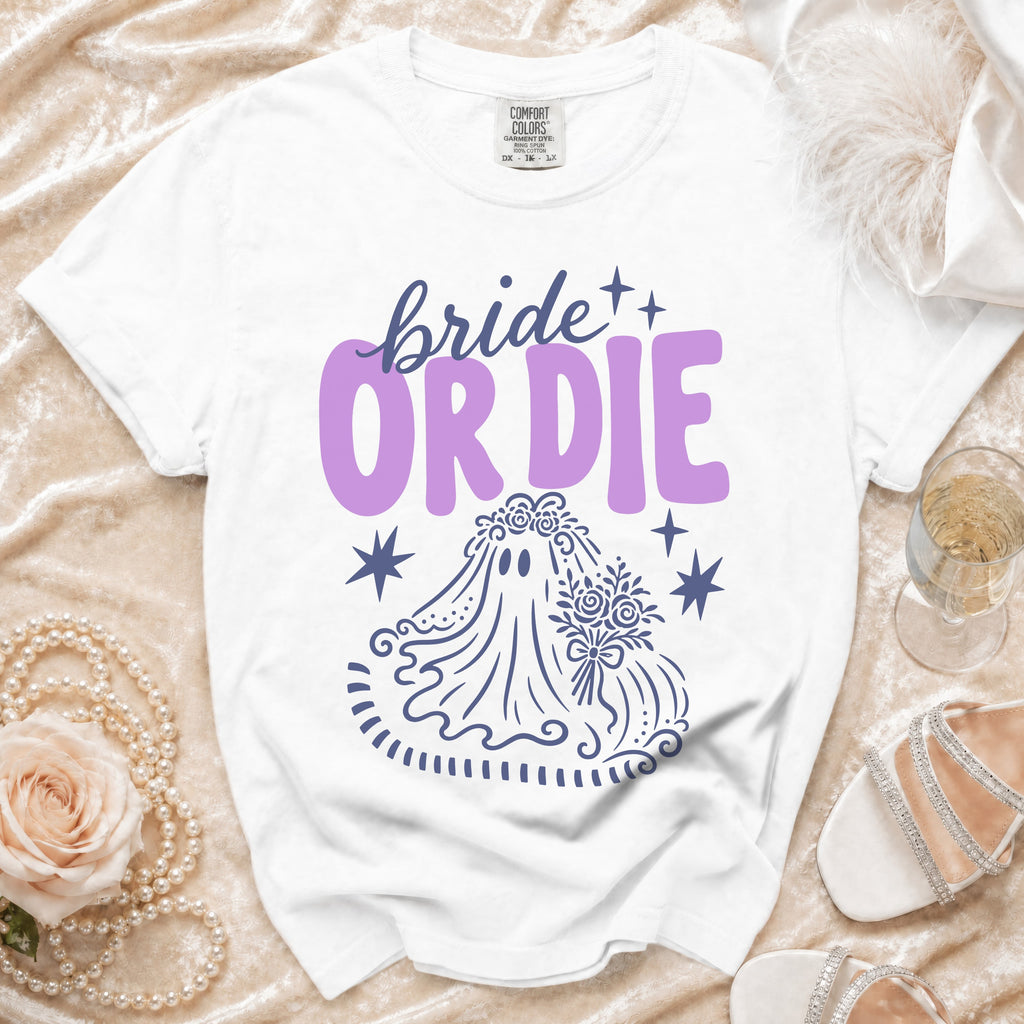 White t-shirt with purple "bride or die" text and ghost bride graphic.