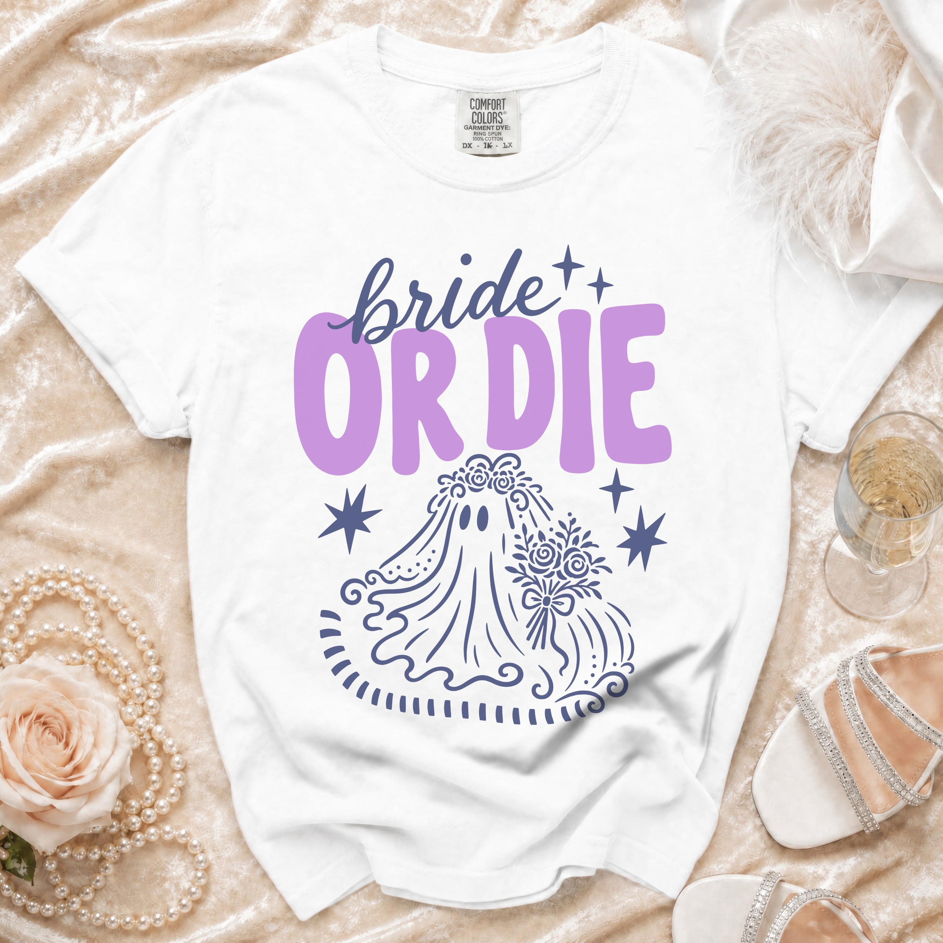 White t-shirt with purple "bride or die" text and ghost bride graphic.