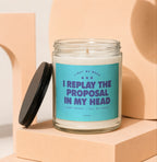 Candle with text "Light me when I replay the proposal in my head."