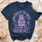 Navy t-shirt with "Mother of the Bride Raising Hell and Paying Bills" graphic.