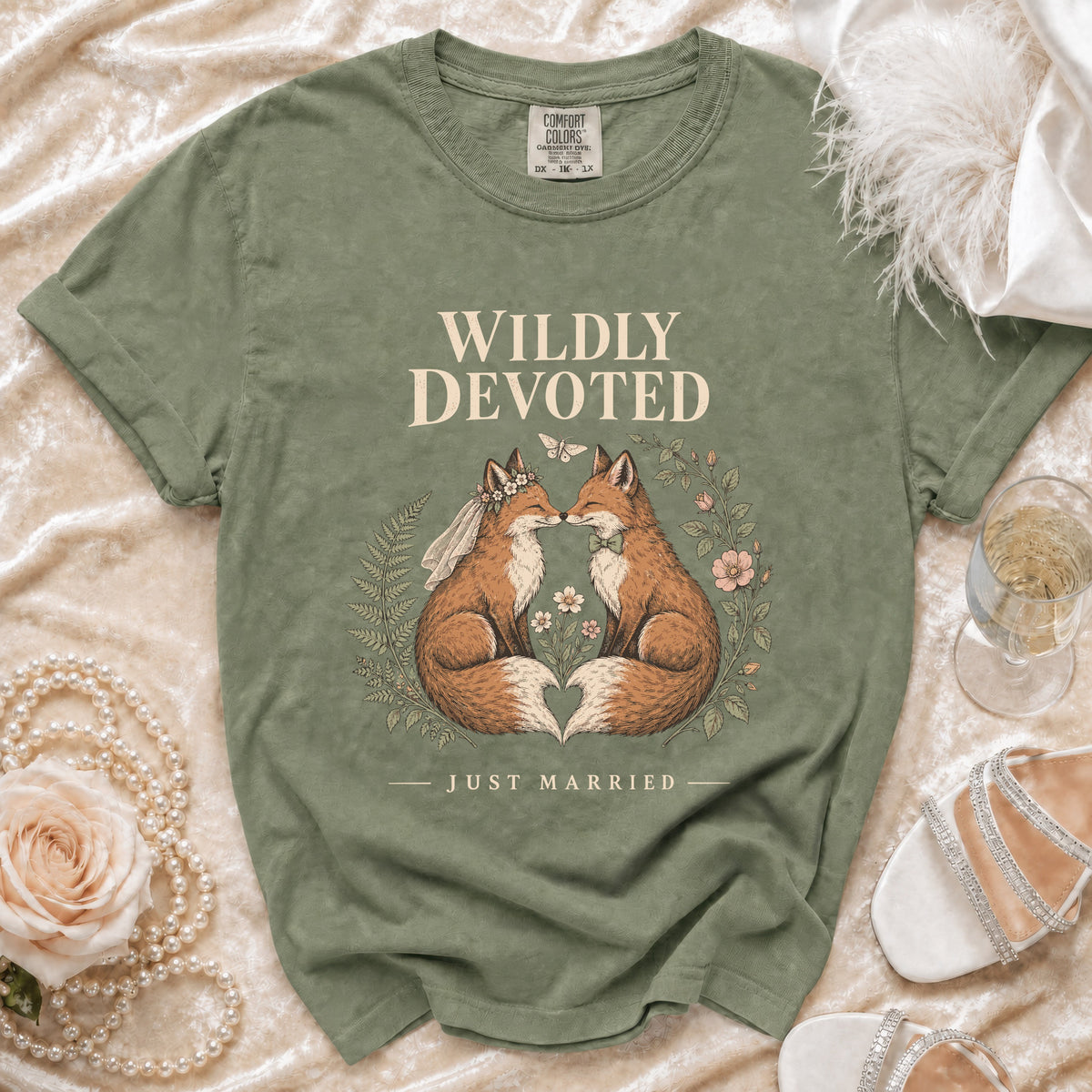 Green t-shirt with "Wildly Devoted Just Married" text and illustrated foxes.