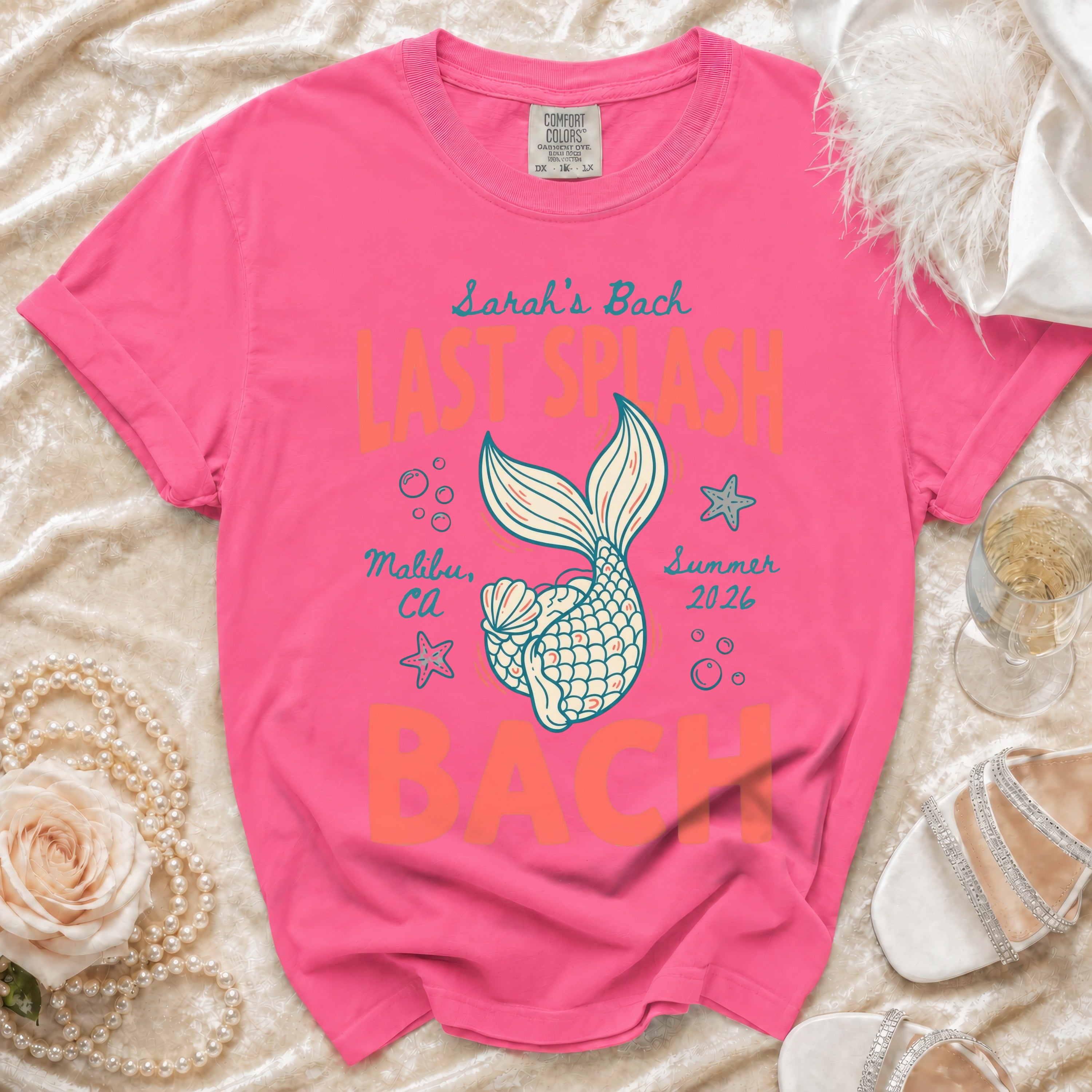 Pink t-shirt with "Sarah's Bach" text and mermaid tail graphic.