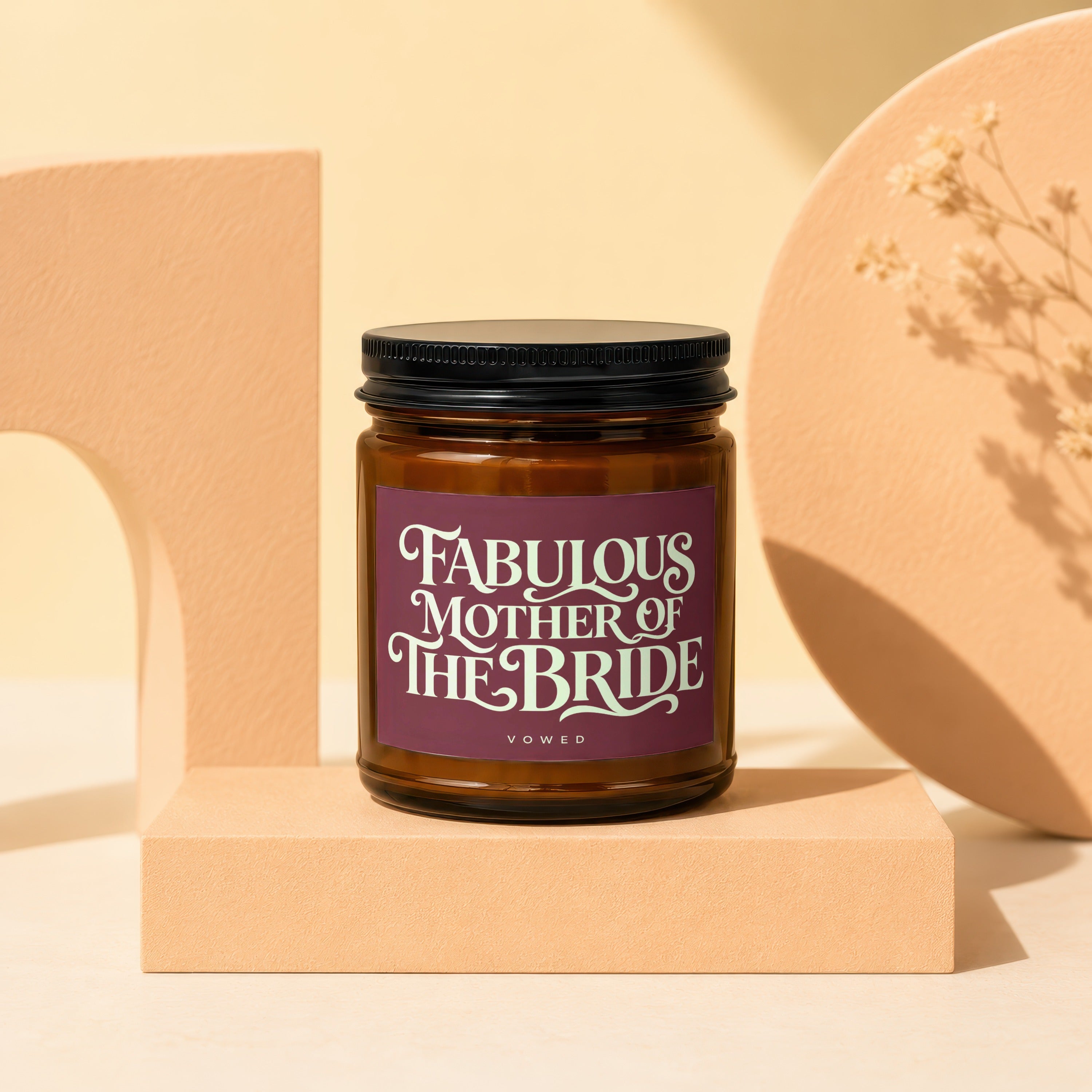 Amber jar candle with "Fabulous Mother of the Bride" text on purple label.