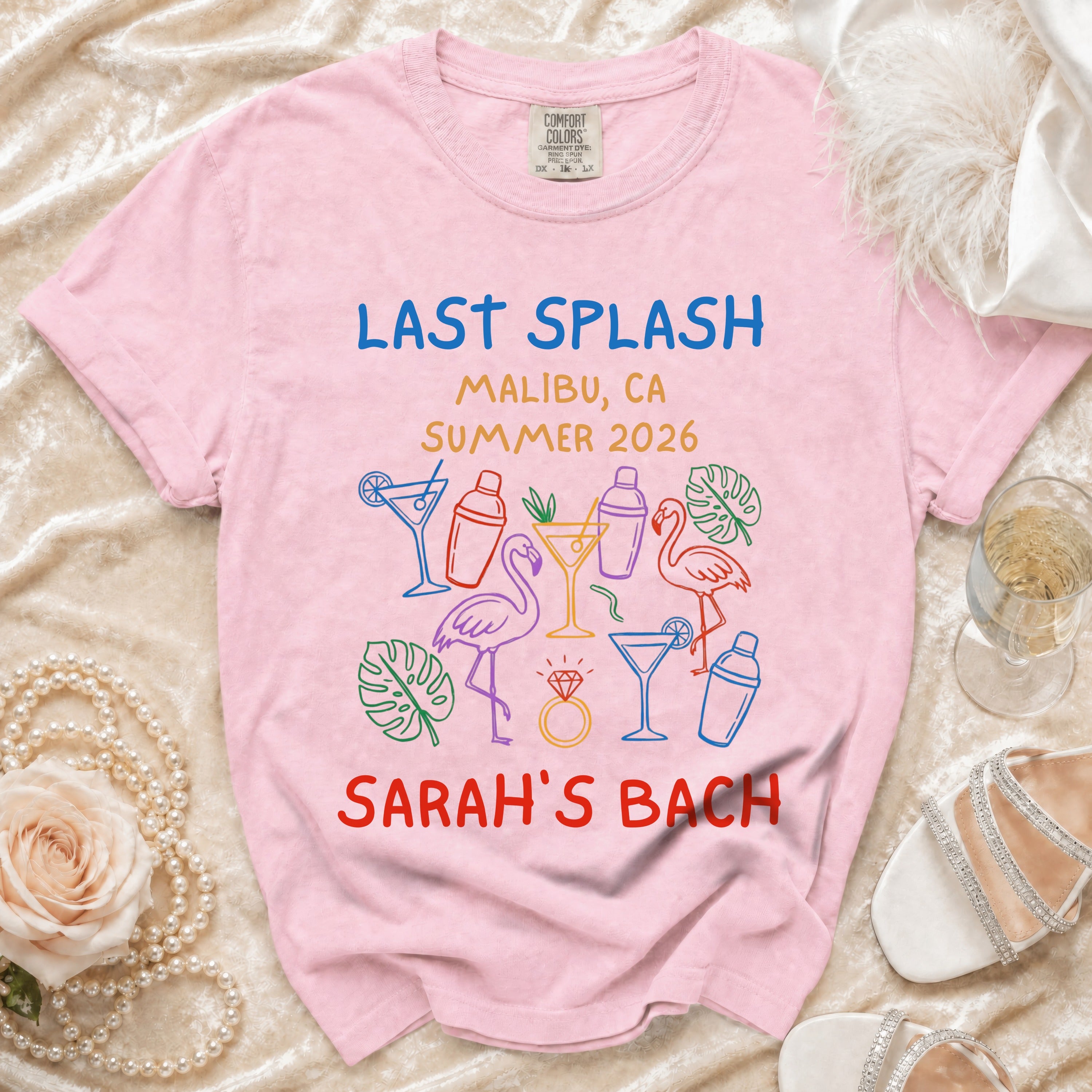 Pink t-shirt with "Last Splash Malibu, CA Summer 2026 Sarah's Bach" and graphic accents.