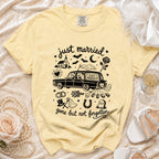 Yellow t-shirt with "just married" graphic of skeleton couple in car, church, bats, and "gone but not forgotten".