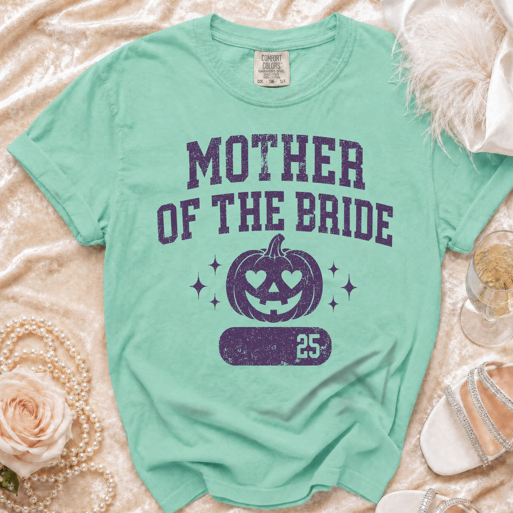 Mint green t-shirt with "Mother of the Bride" text and pumpkin graphic.