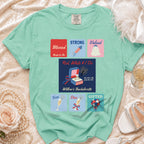 Mint green t-shirt with "Blessed", "Strong", "Valued", "Free", "Dice", "Gifted", and "Bride-to-Be" text.
