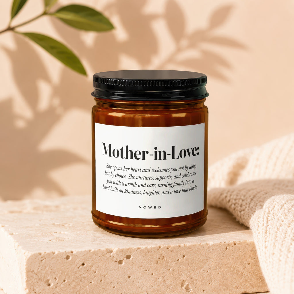 Amber glass candle labeled "Mother-in-Love" with descriptive text.