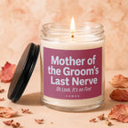 Glass jar candle with burning wick, labeled "Mother of the Groom's Last Nerve".