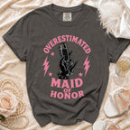 T-shirt with "Overestimated Maid of Honor" text and graphic of a hand holding champagne and ring.