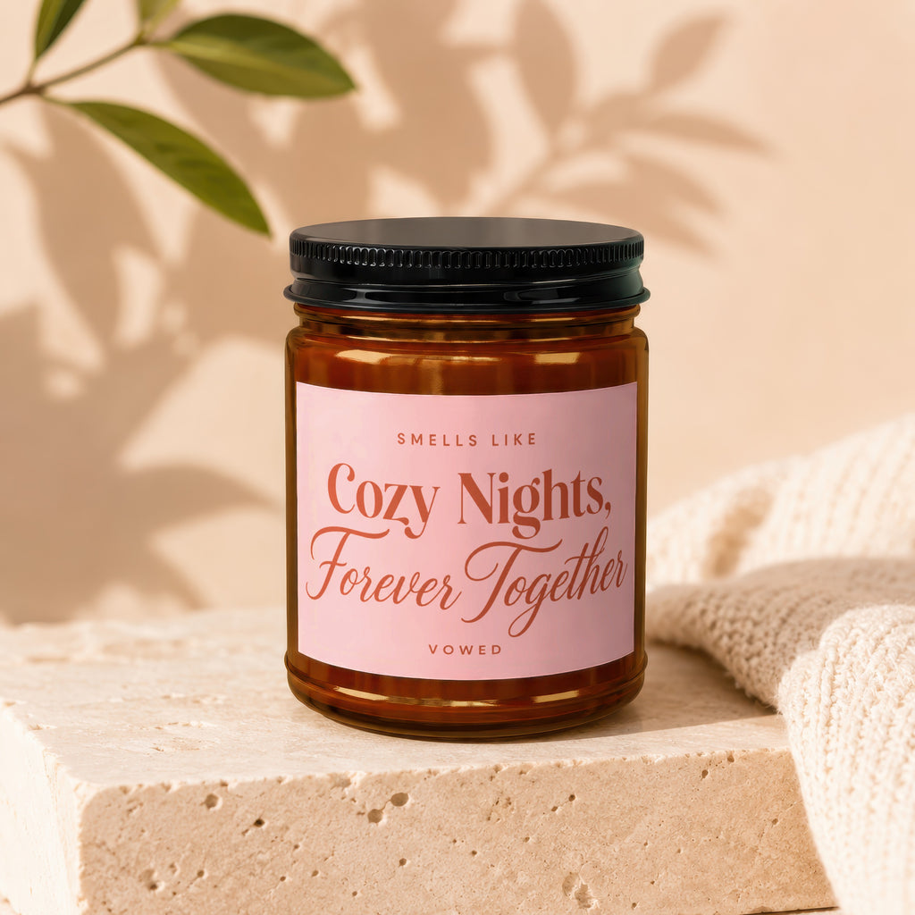 Candle labeled "Smells like Cozy Nights, Forever Together" by Vowed.