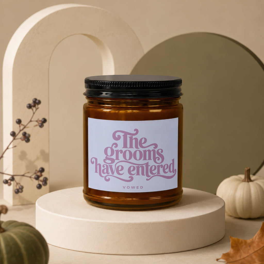 Amber glass candle with "The grooms have entered" and "vowed" text.
