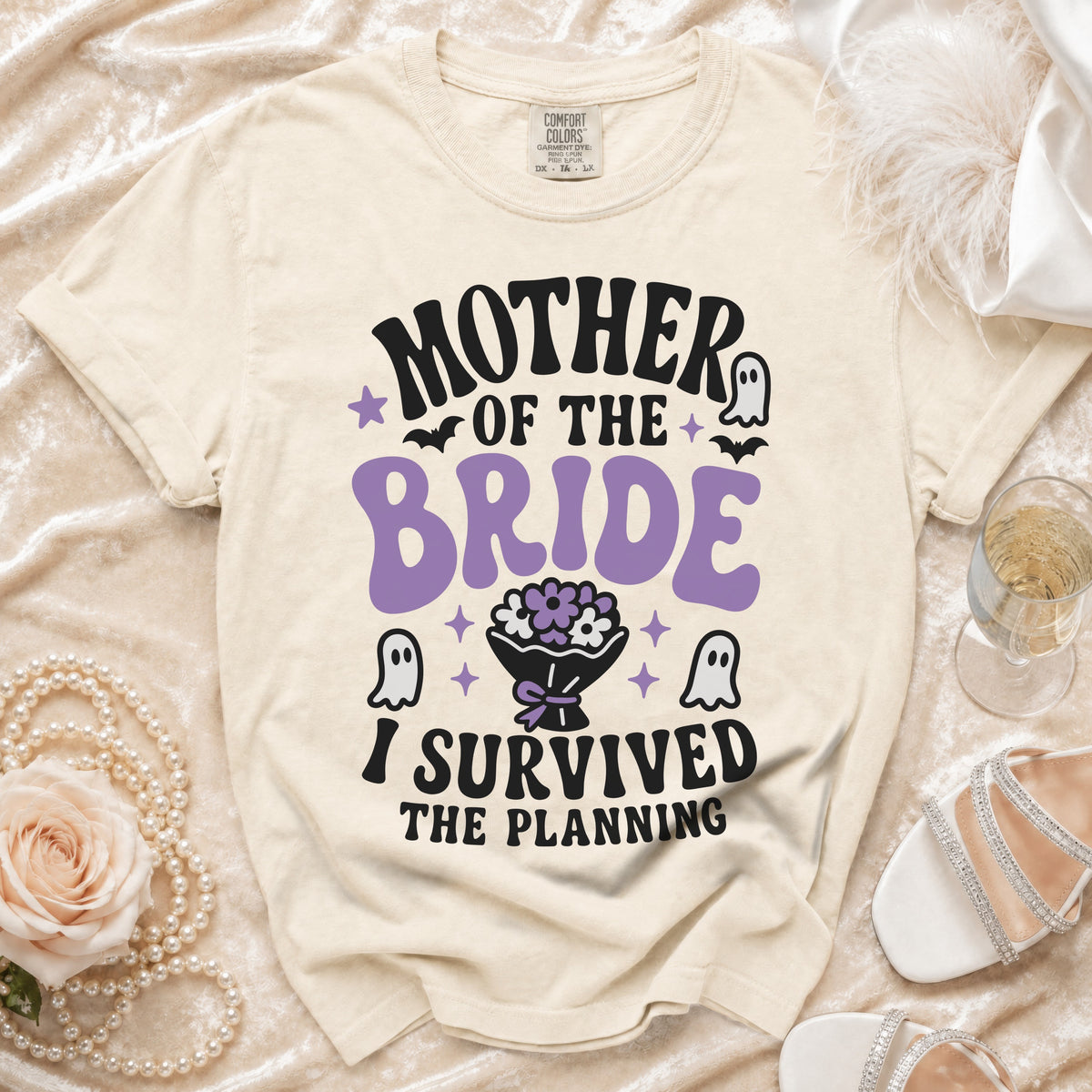 Cream t-shirt with "Mother of the Bride I Survived the Planning" text and ghost graphics.