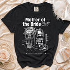 Black t-shirt with "Mother of the Bride Club" text, skull, and pumpkin design.
