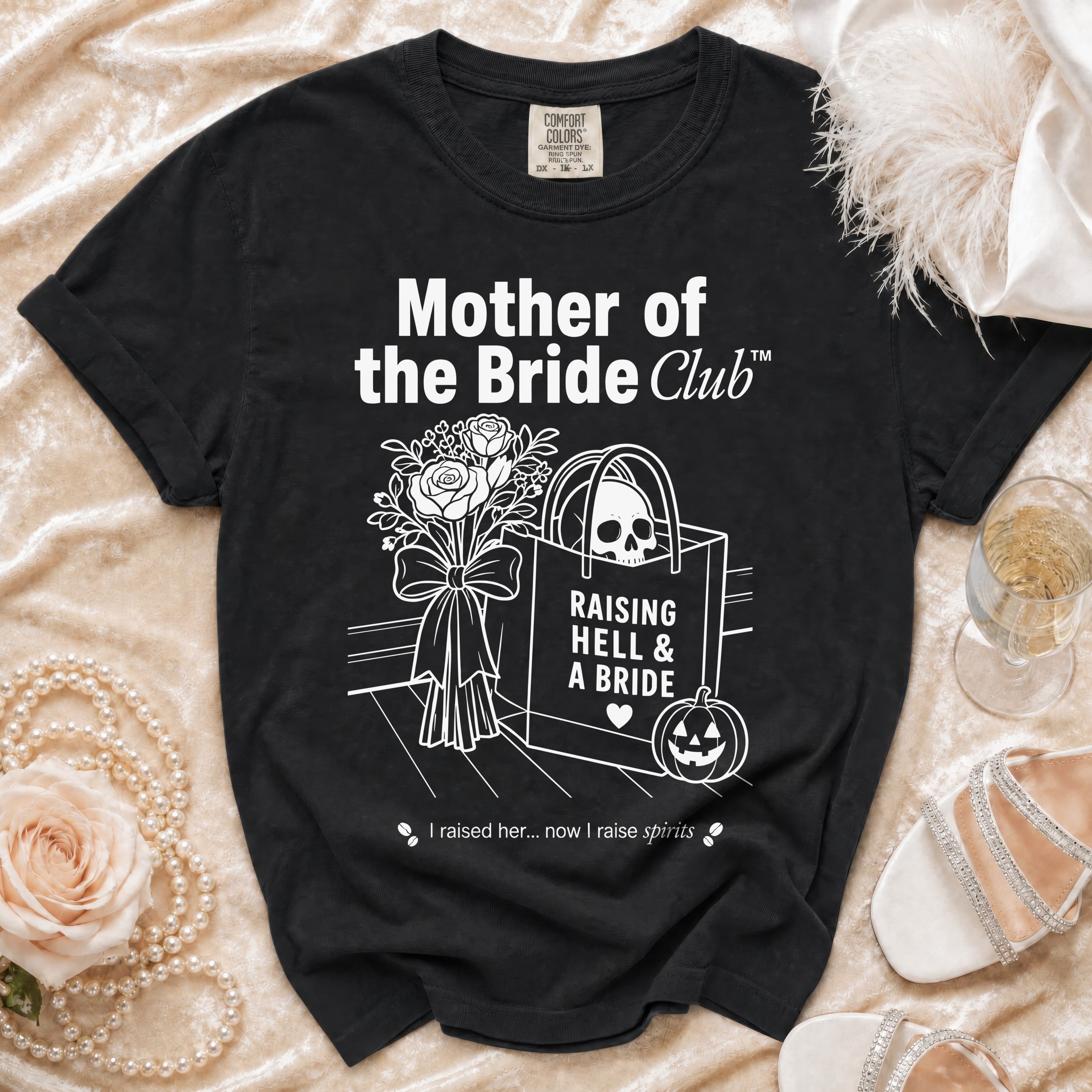 Black t-shirt with "Mother of the Bride Club" text, skull, and pumpkin design.