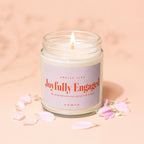 Jar candle labeled "Smells like Joyfully Engaged, one proposal was never going to be enough, Vowed".