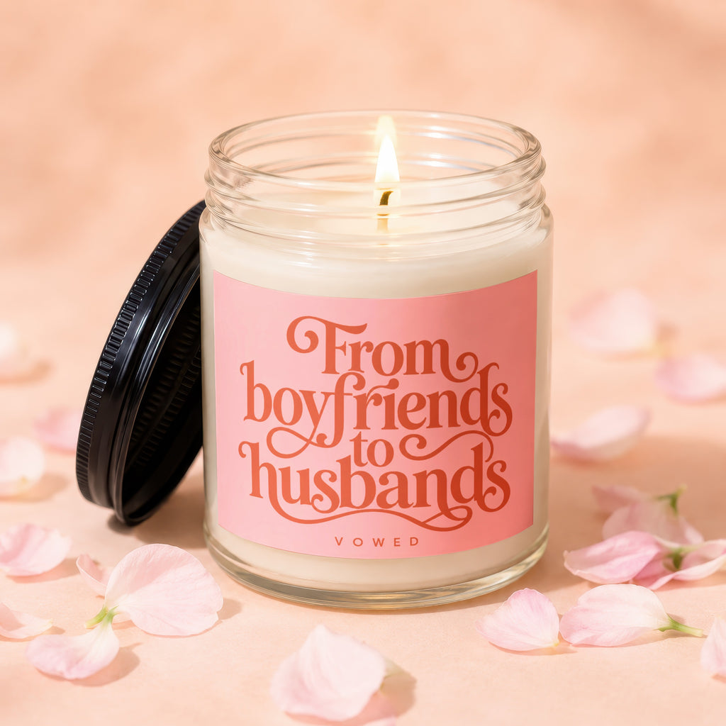 Glass candle with pink label reads "From boyfriends to husbands VOWED".