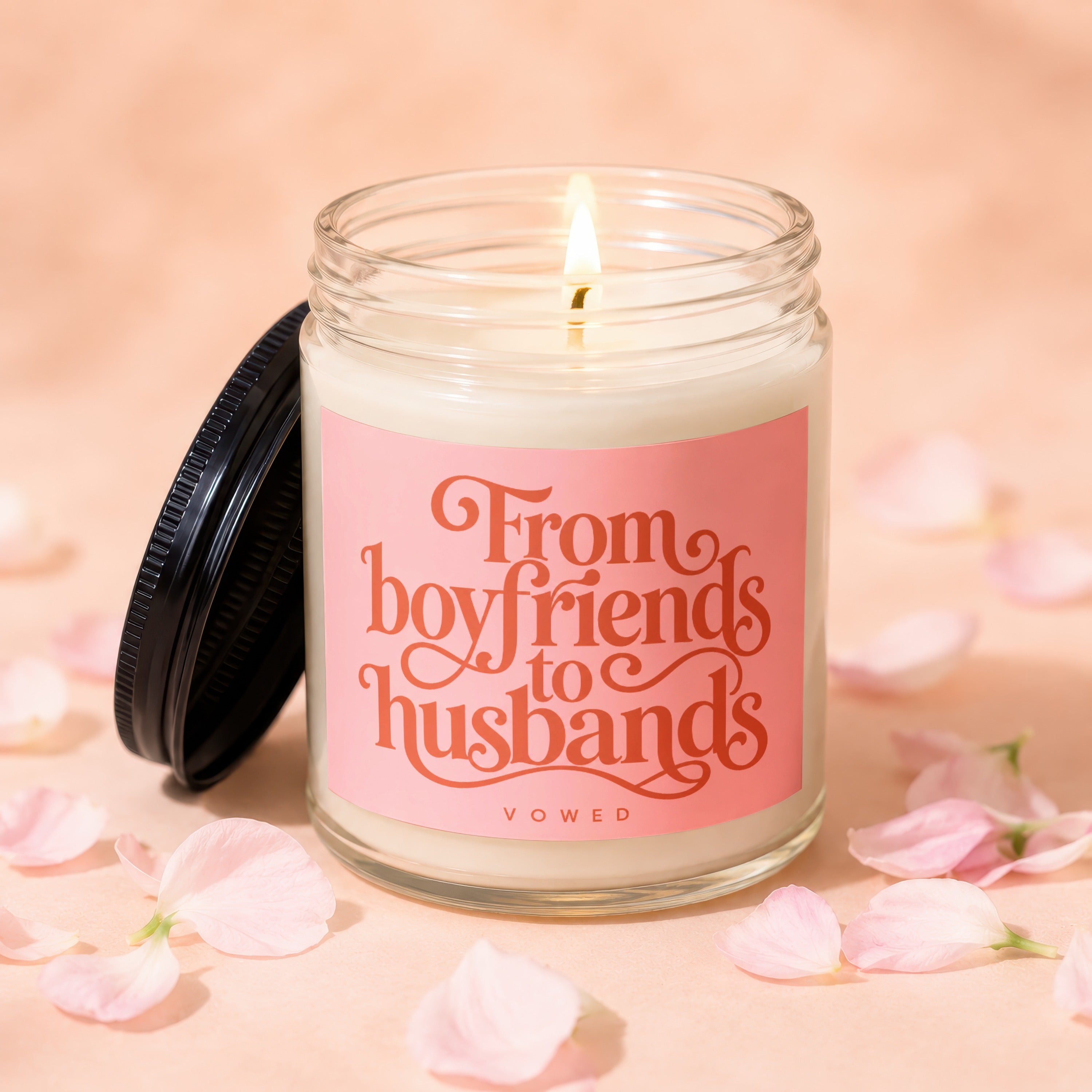 Glass candle with pink label reads "From boyfriends to husbands VOWED".