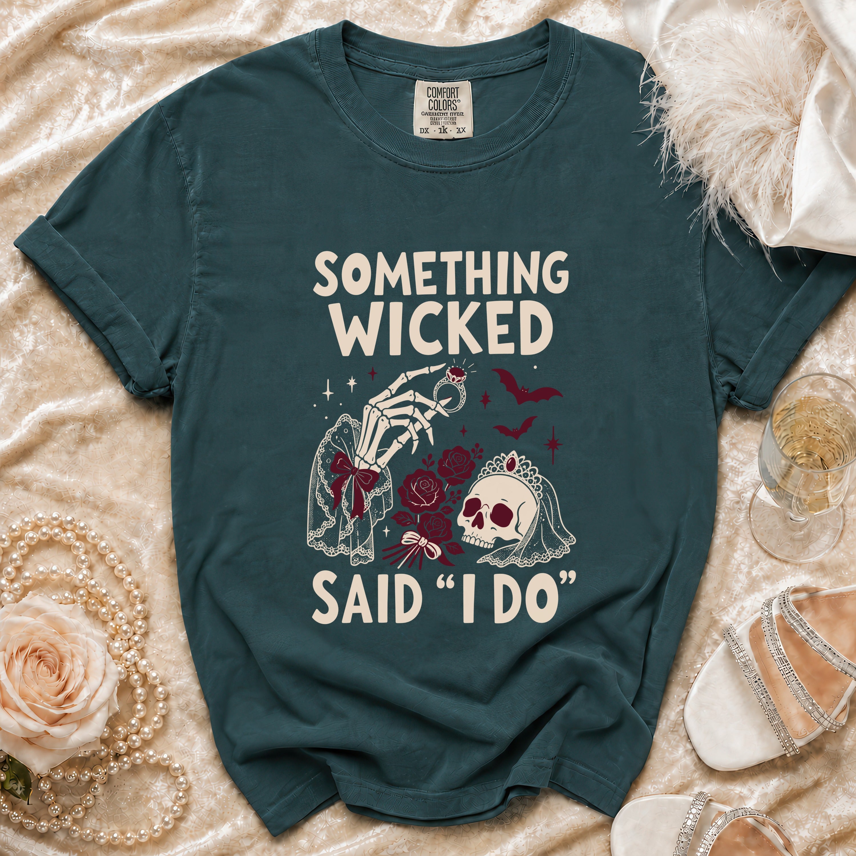 Teal t-shirt with "Something Wicked Said 'I Do'" skeleton, skull, and roses graphic.