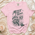 Pink t-shirt with "MILF of Honor" text and graphic of a tiara, flowers, and champagne glasses.