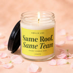 Glass candle with lit wick and yellow label that reads "Same Roof, Same Team Every Single Day VOWED".