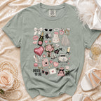 T-shirt with "Bride to Be" text and wedding-themed graphics: cake, champagne, ring.