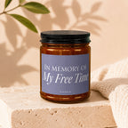 Brown glass candle with a lavender label reading "IN MEMORY OF My Free Time VOWED".