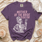 Purple t-shirt with "Mother of the Bride to Die For" text and skeleton graphic.