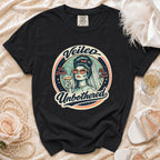 Black t-shirt with "Veiled Unbothered" bridal graphic holding a drink.