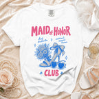 White t-shirt with "Maid of Honor Club" text and illustrations.
