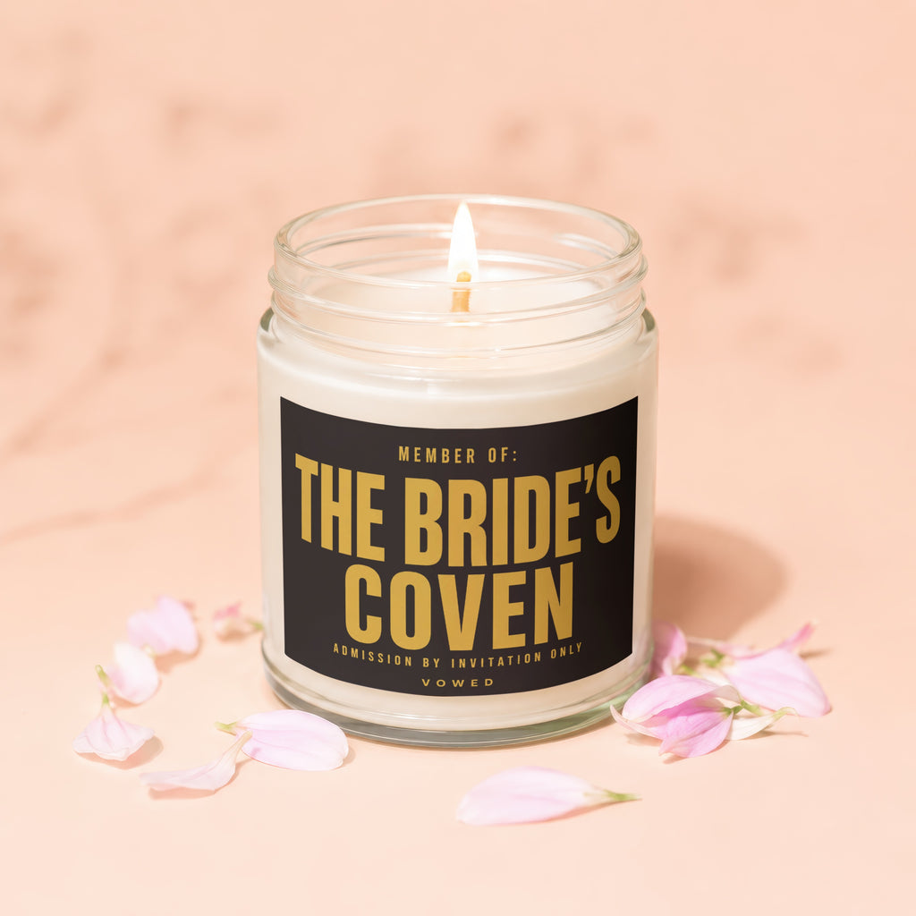 Soy candle with "The Bride's Coven" text, admission by invitation only.