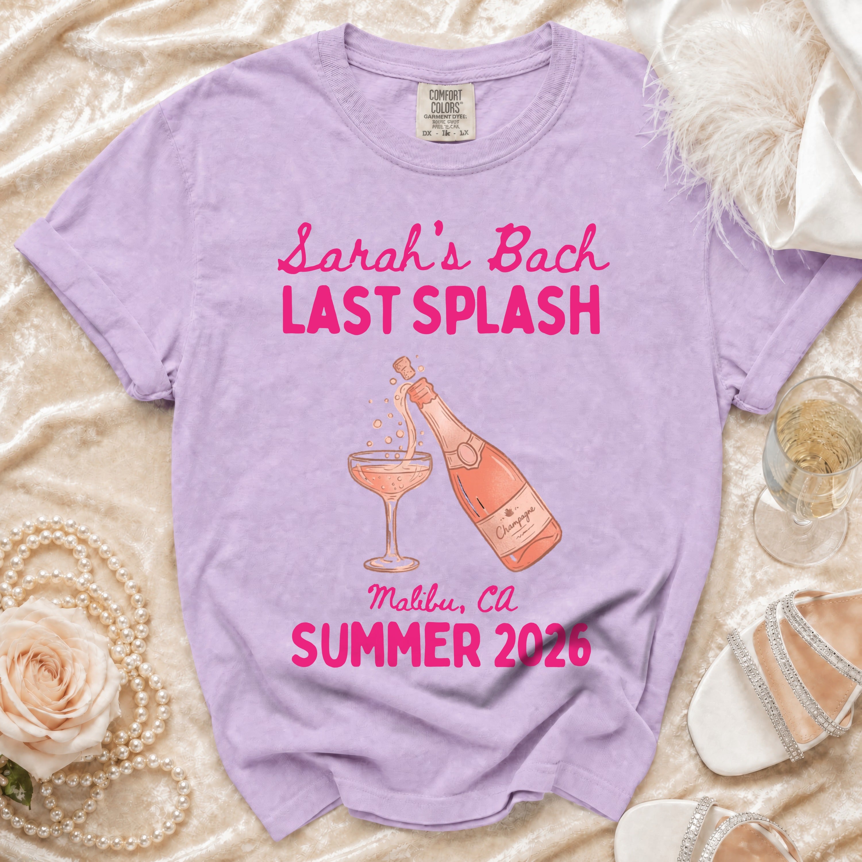 Lilac t-shirt with "Sarah's Bach LAST SPLASH" and champagne graphics.