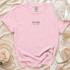 Pink t-shirt with "bride est. 2026" graphic.