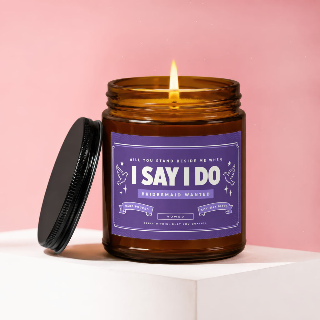 Candle with purple label that says "I Say I Do Bridesmaid Wanted".