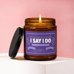 Candle with purple label that says "I Say I Do Bridesmaid Wanted".