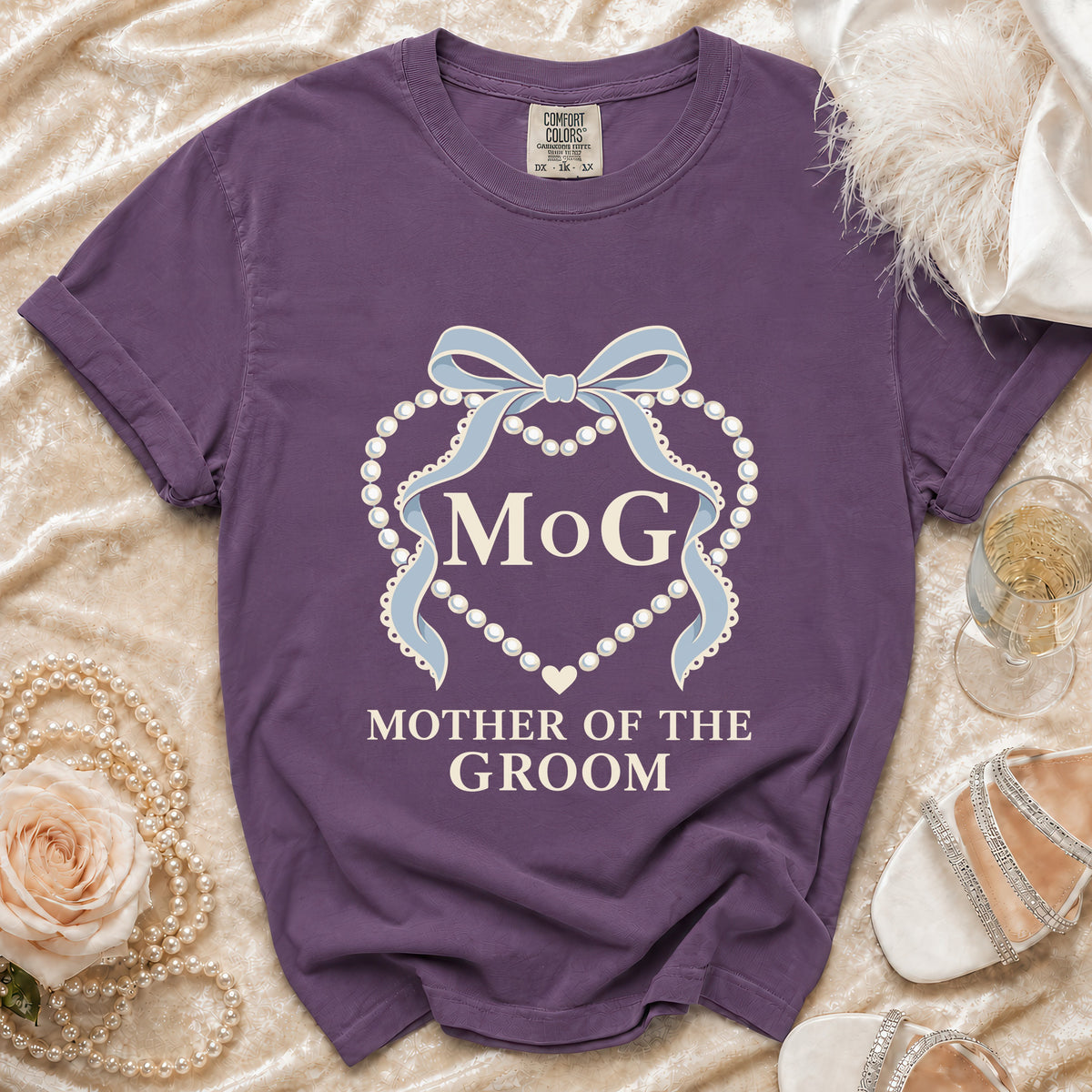 Purple t-shirt with "MOG" and "Mother of the Groom" text and pearl design.
