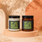 Two scented candles with "My Last Night of Freedom" labels on display stands.