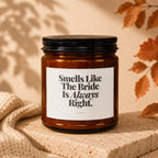 Amber candle with black lid labeled "Smells Like The Bride Is Always Right."