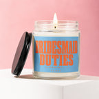 Candle with "Bridesmaid Duties (Loading...) Vowed" text on a blue label.