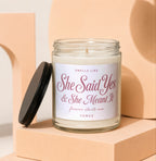 "She Said Yes & She Meant It" candle with lid off, "forever starts now" text.
