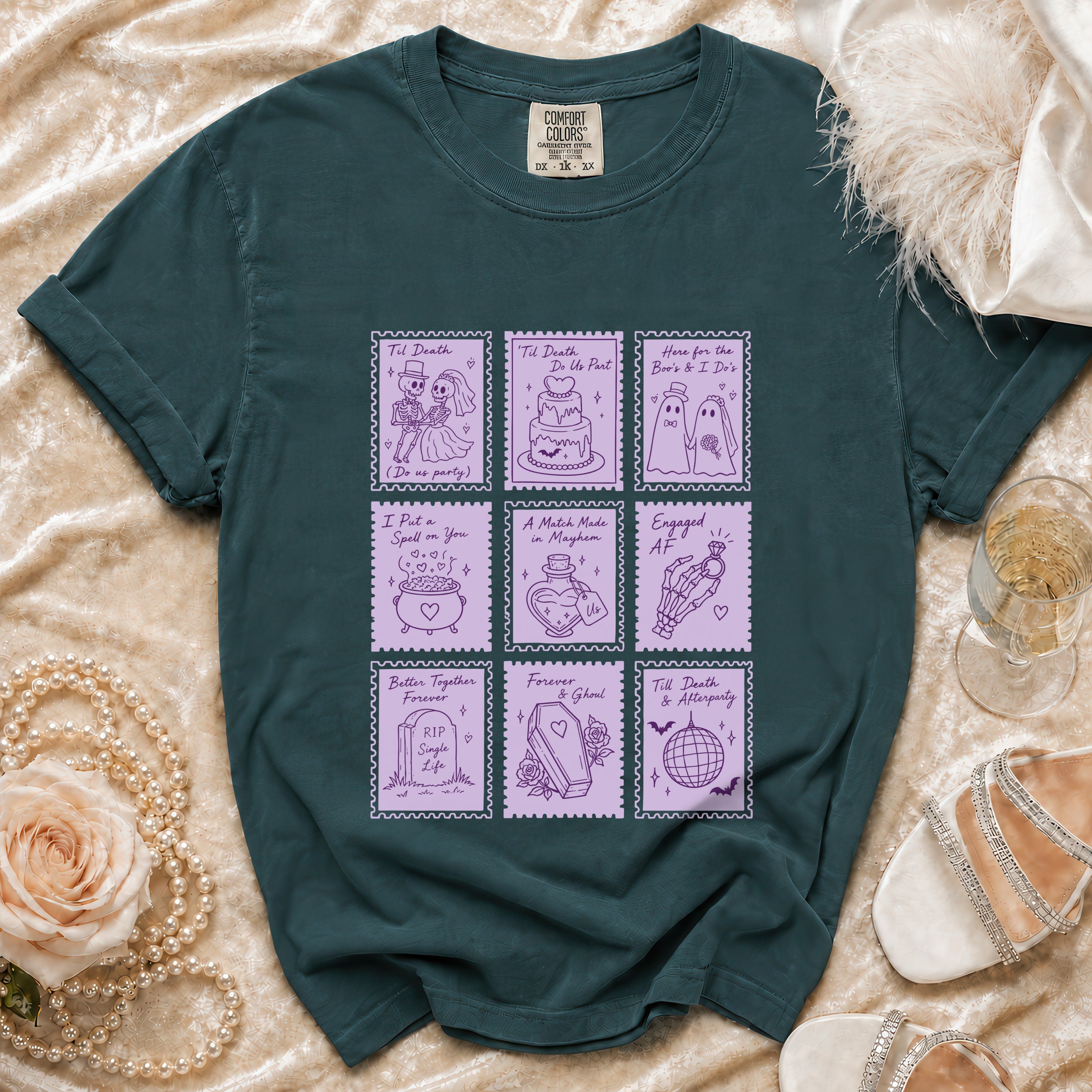 Green t-shirt with nine purple stamp-like designs of gothic wedding themes.