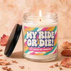 Candle with "MY RIDE OR DIE! MY MAID OF HONOR VOWED" text on a rainbow stripe label.