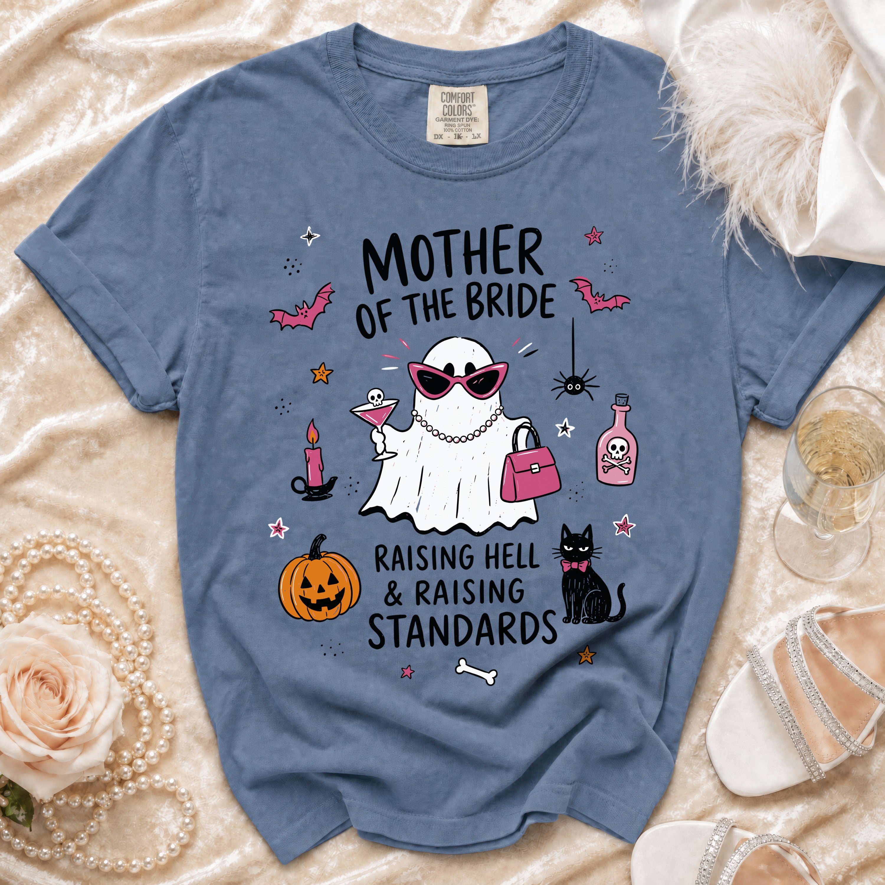 Blue t-shirt with "Mother of the Bride" text and Halloween-themed graphics.