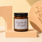 Amber glass candle with "Circle of Trust" and "VOWED" labels.