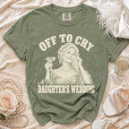 Green t-shirt with "Off to Cry At My Daughter's Wedding" graphic.
