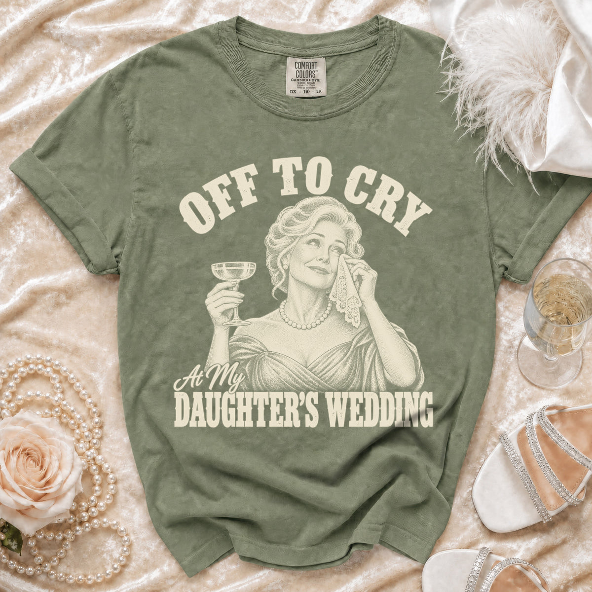 Green t-shirt with "Off to Cry At My Daughter's Wedding" graphic.