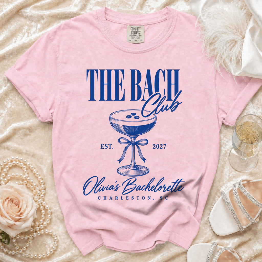Pink t-shirt with "The Bach Club" and "Olivia's Bachelorette Charleston, SC" text.