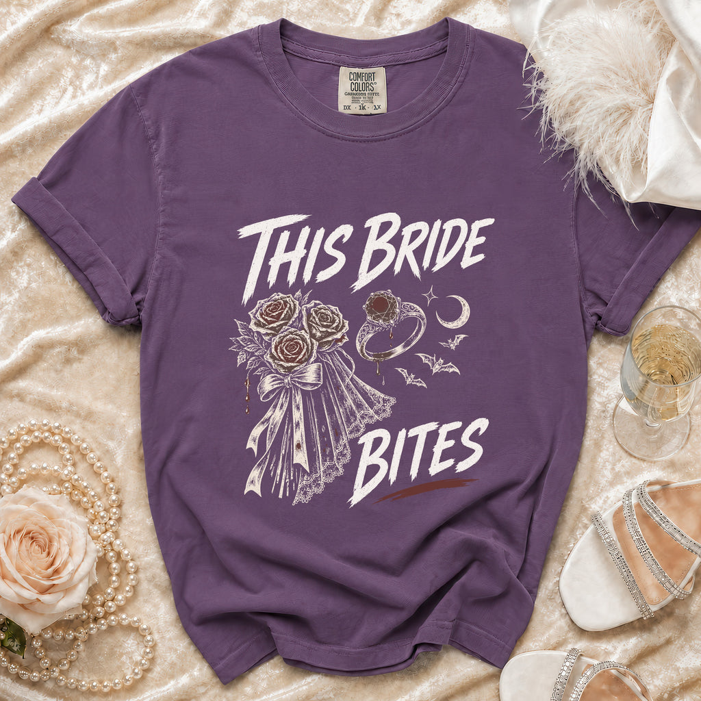 Purple t-shirt with "This Bride Bites" text and gothic bridal graphics.