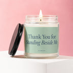 Candle with lit wick inscribed "Thank You for Standing Beside Me" and "vowed".